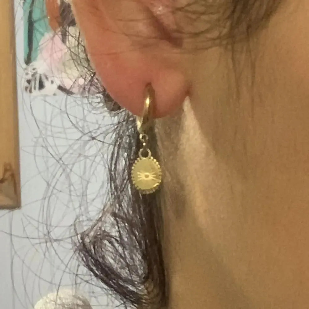 Stainless steel geometric ear button earrings with ellipse design in silver tone