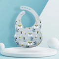 Silicone baby eating bib with adjustable neck and deep catch pocket on a child