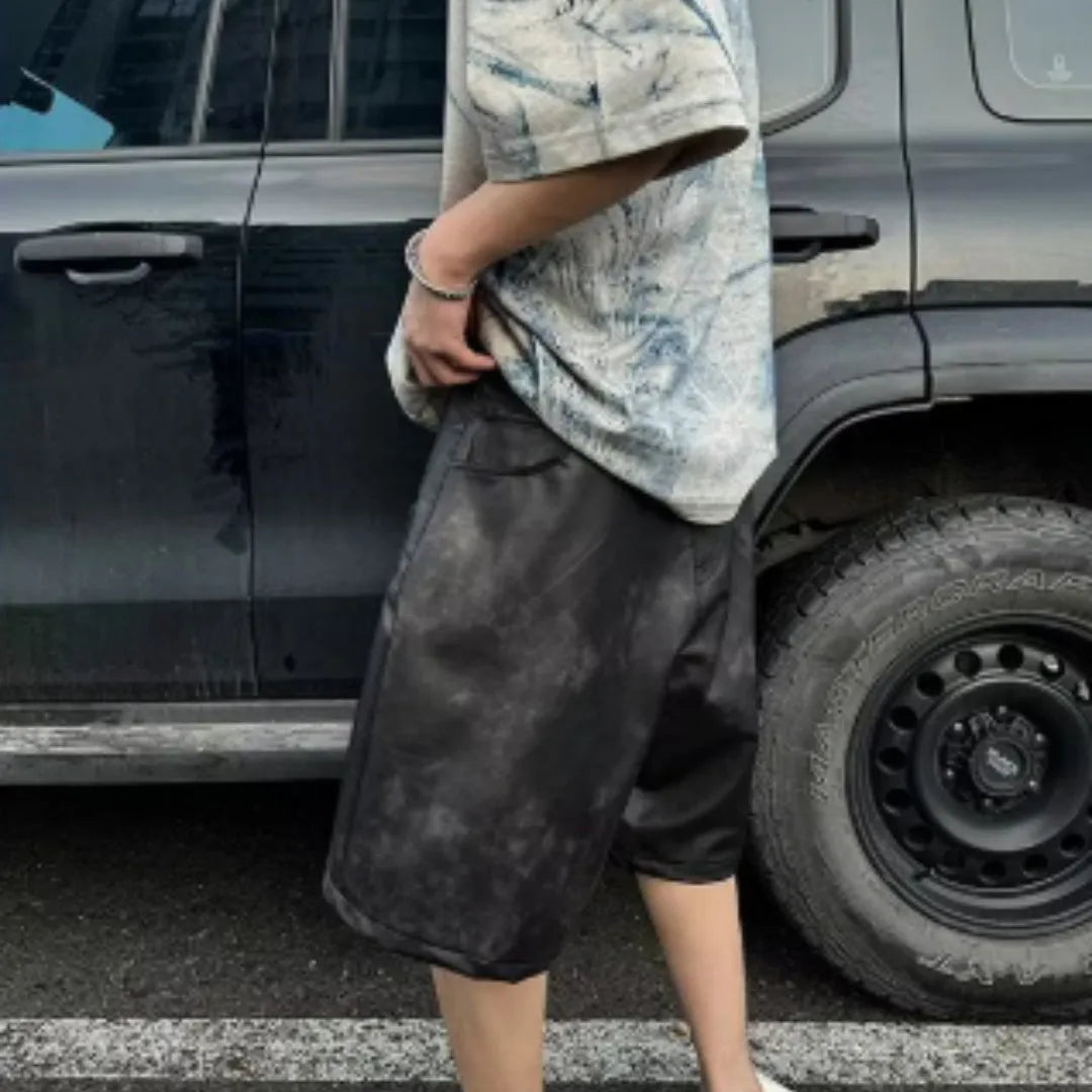 Dirty print pattern on a solid colour loose fit Korean style short sleeve t-shirt.