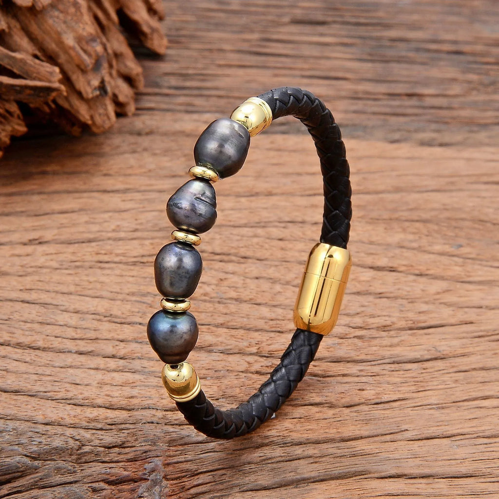 Handmade unisex bracelet with irregular pearls on adjustable leather strap in grey pearl and black.