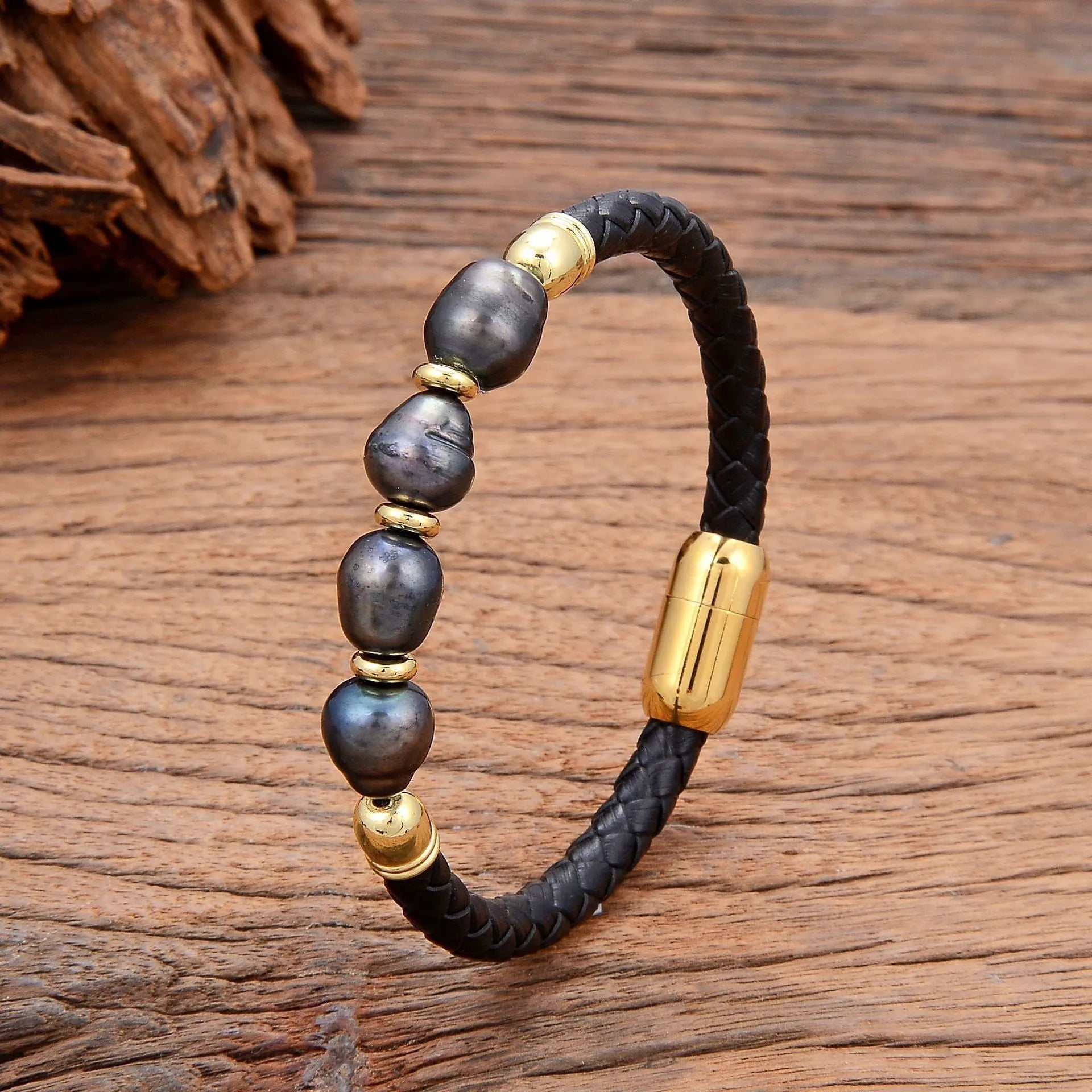 Handmade unisex bracelet with irregular pearls on adjustable leather strap in grey pearl and black.