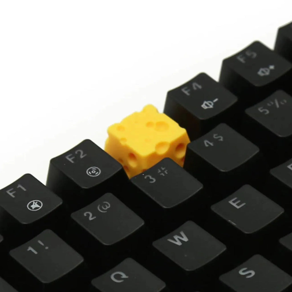 Solid yellow resin artisan key cap with detailed cheese design for MX mechanical keyboards.