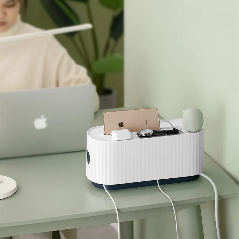 Blue and white HIPS plastic power strip storage box with lid open, showing cable holes and interior space.