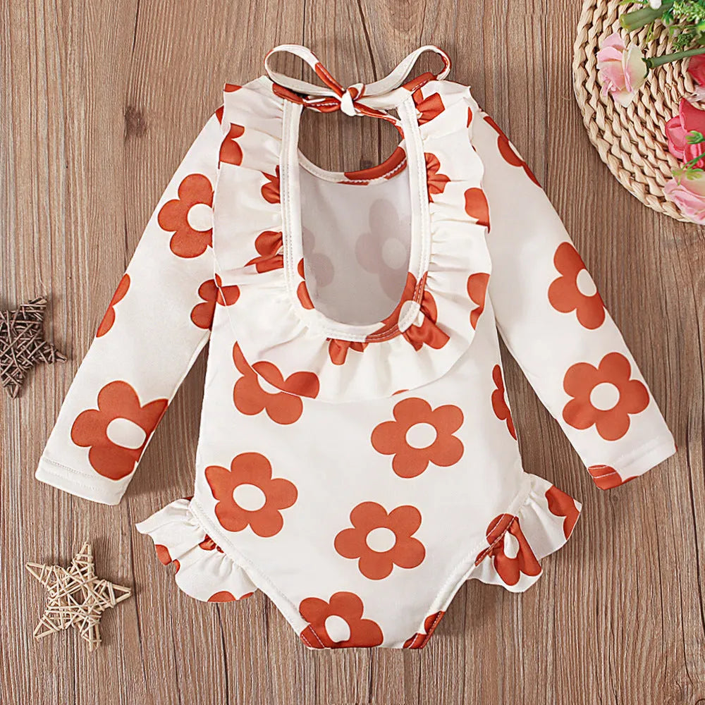 Girl's floral pattern open back swimsuit in orange red, available in sizes 70 to 110 yards.