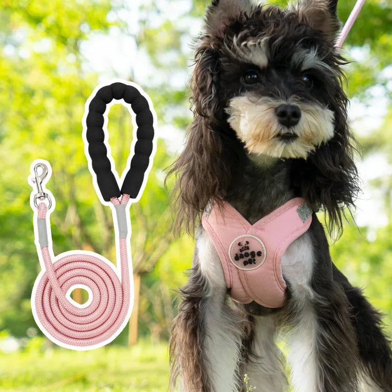 A blue polyester dog vest with an attached hand-holding rope for walking control.
