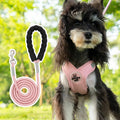 A blue polyester dog vest with an attached hand-holding rope for walking control.