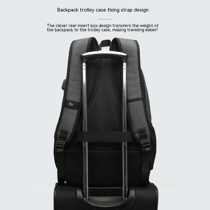 Simple lightweight backpack with USB charging interface in grey colour showing dimensions and trolley compatibility