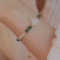 Chinese style olivine bracelet with Hetian jade and copper shell pearls featuring bamboo joint design