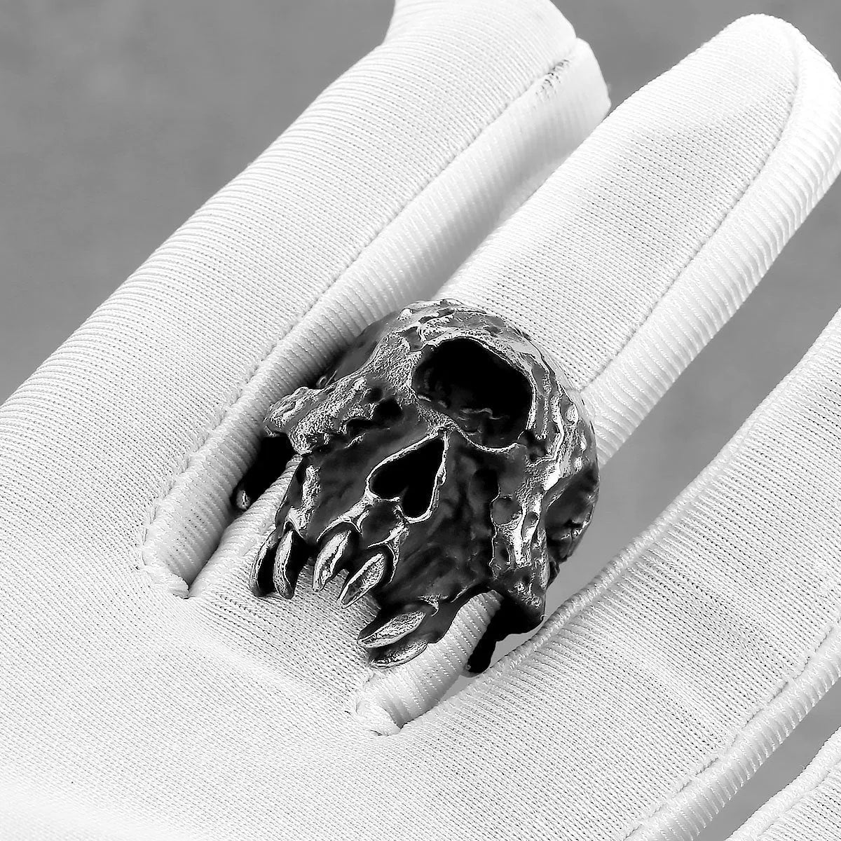 A retro-style alloy ring with a one-eyed skull design, shown in silver tone.