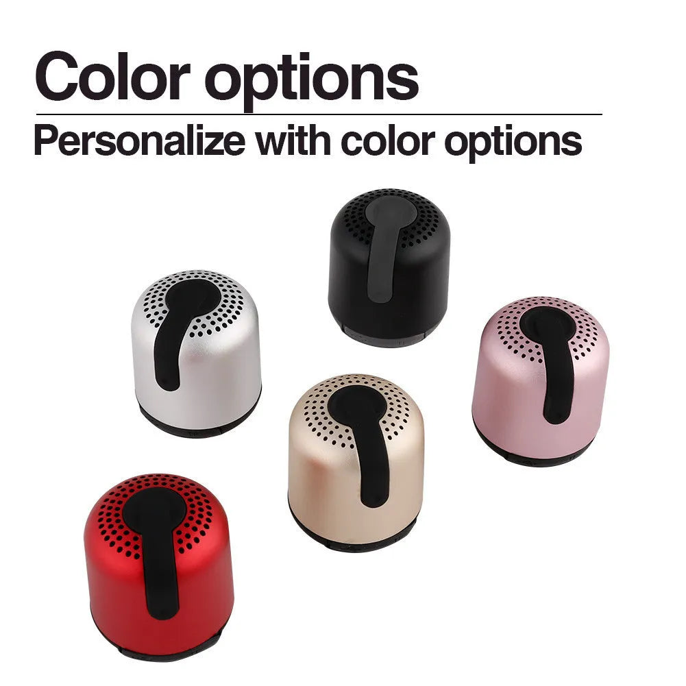 Hieha XQ11 mini cylindrical portable Bluetooth speaker in silver colour on a table