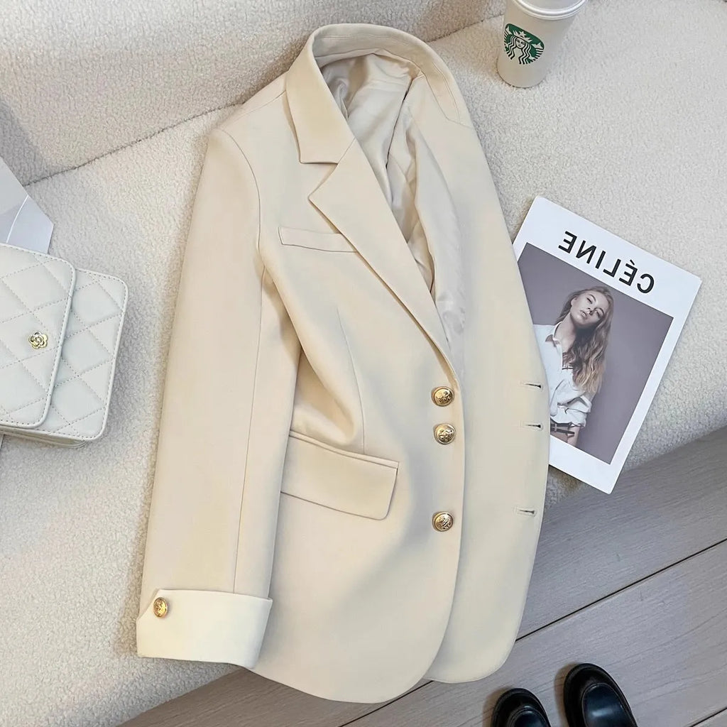 Korean style loose fit women's coat in milky white, showing long sleeves and pockets.