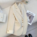 Korean style loose fit women's coat in milky white, showing long sleeves and pockets.