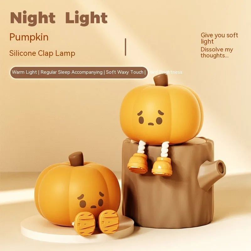 Soft silicone pumpkin-shaped night light with warm yellow glow