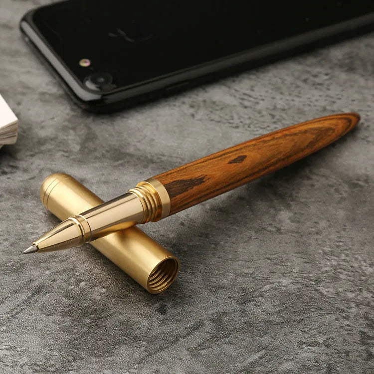 Brass and sandalwood signature pen with wooden barrel, shown alongside a ruler indicating 14 cm length.