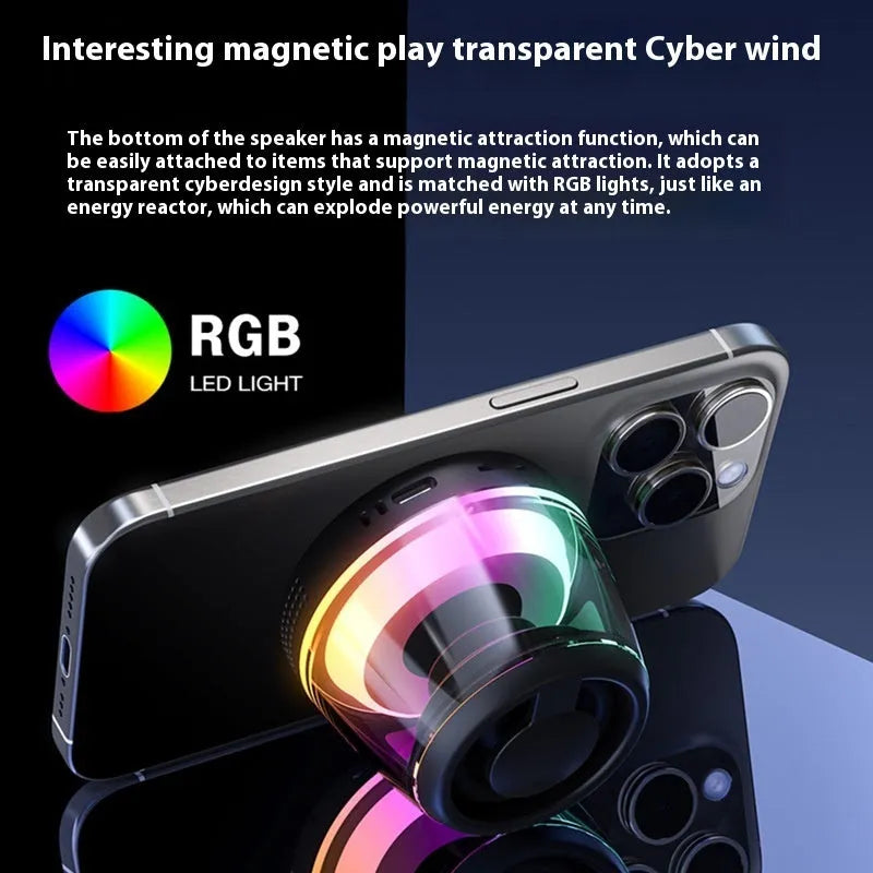 Small portable black Bluetooth speaker with coloured ambient light, shown with a magnetic base.