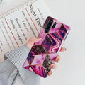 Electroplated marble pattern TPU back cover case for a mobile phone.