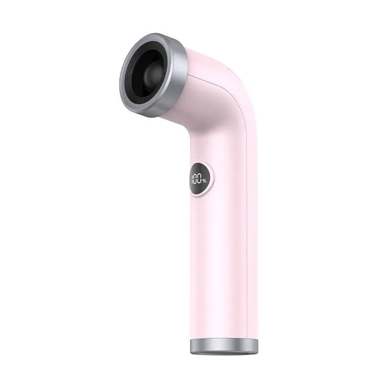 Apricot coloured bladeless portable turbine fan with power cord on a desk.