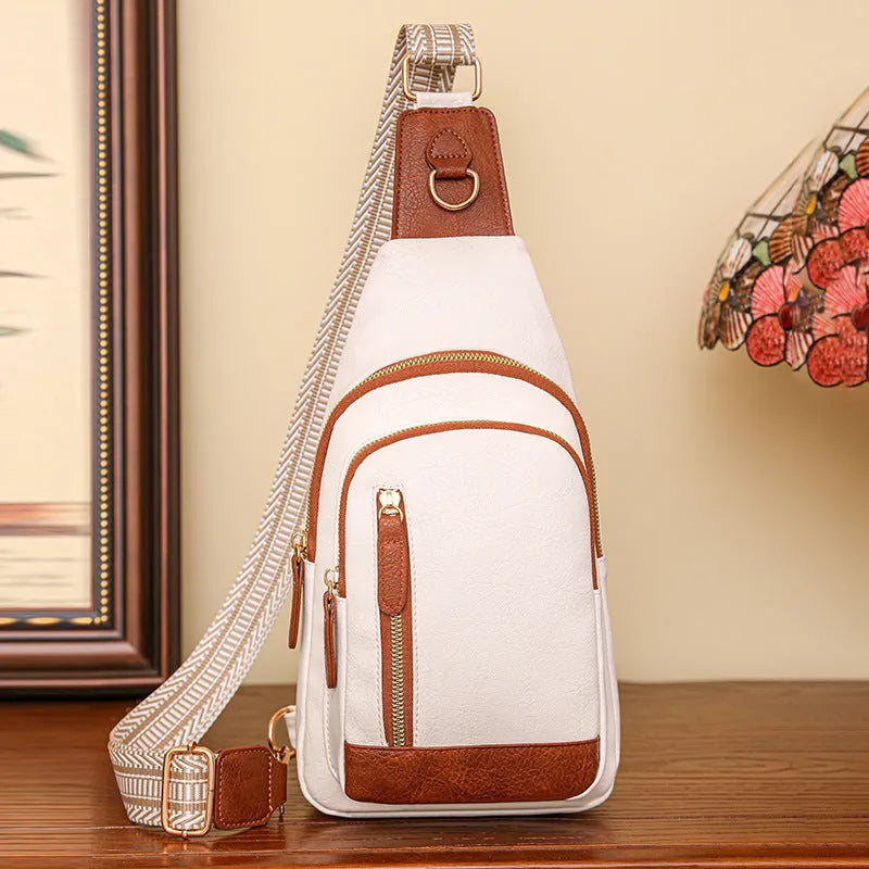 Women's soft brown PU leather crossbody chest bag with an open front pocket.