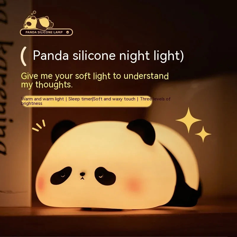 Cartoon panda silicone night light for kids with clap control on a bedside table