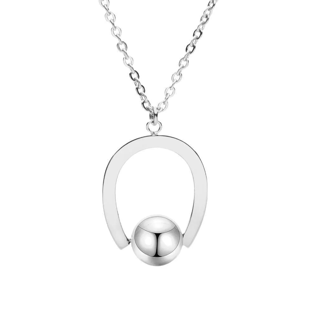 Gold-coloured adjustable stainless steel necklace with a geometry pendant on a cross chain.