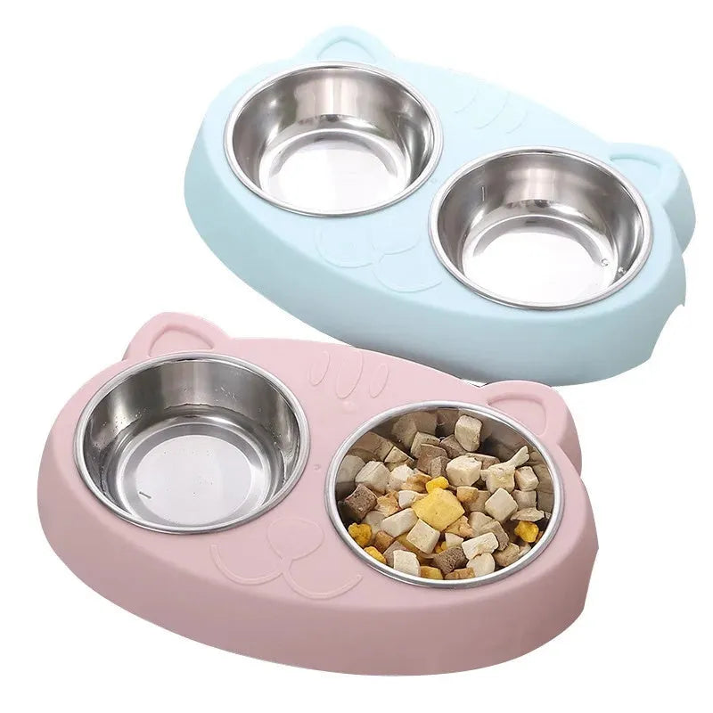 Blue plastic macaron-shaped double bowl pet feeder tray with a non-slip base and centre divider.