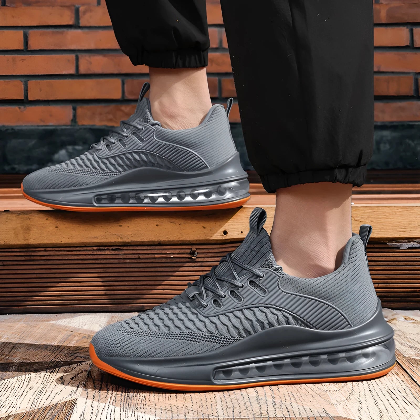 Men's black mesh running shoes with round toe and lace-up front, showing cushion damping sole