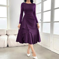Purple women's long sleeve pullover dress with ruffled detail on a mid waist.