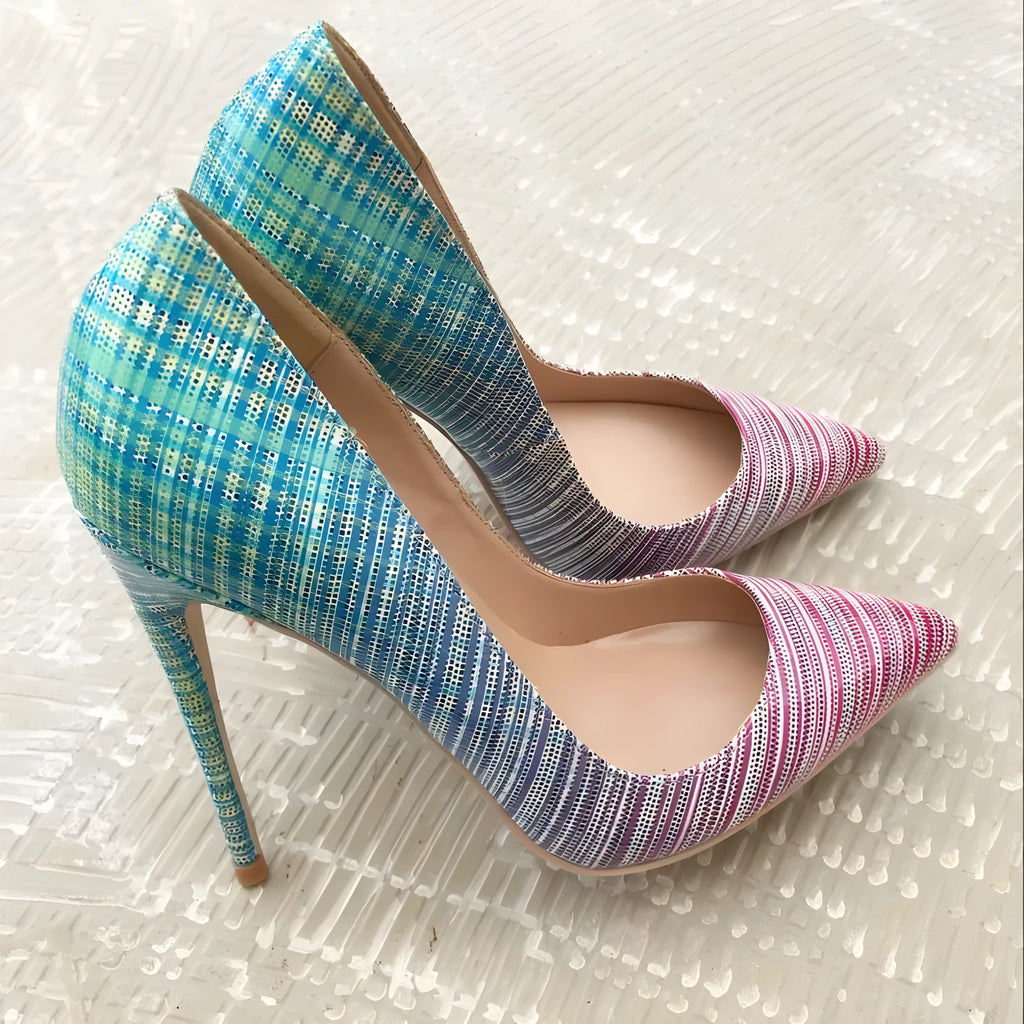 Women's pink and blue gradient patent leather pointed toe stiletto heels on a white background.