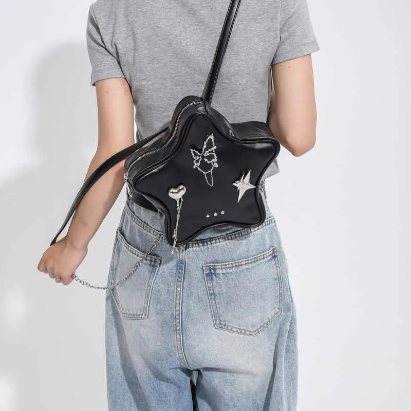 Soft black PU women's mini backpack worn across the body as a messenger bag.