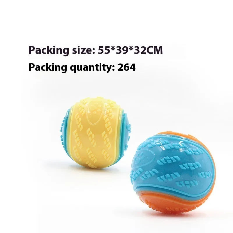 TPR dog training ball with squeaker in bright two-tone colours, showing molar texture on surface.