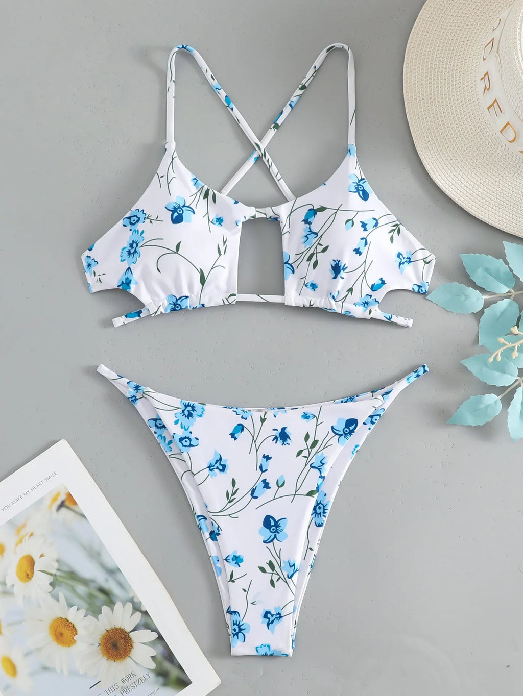 Women's floral print swimsuit set with triangle tie-neck top and matching shorts
