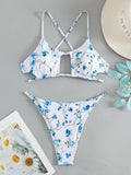 Women's floral print swimsuit set with triangle tie-neck top and matching shorts
