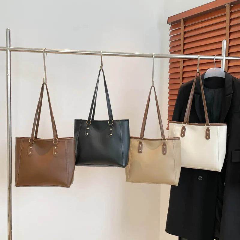 PU leather contrast colour tote bag with horizontal square shape and outer slit pocket.