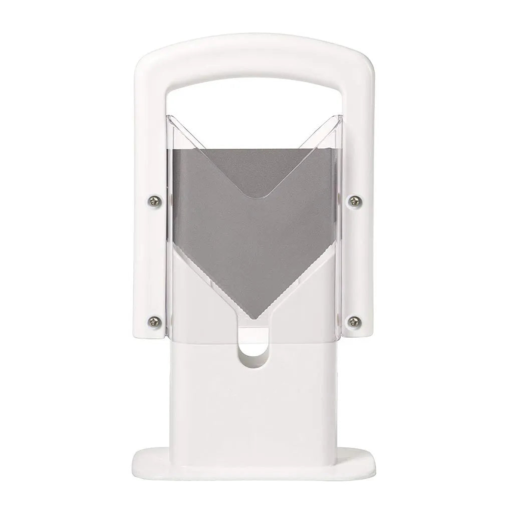 White plastic bagel slicer with acrylic safety shield and stainless steel serrated blade on a kitchen counter