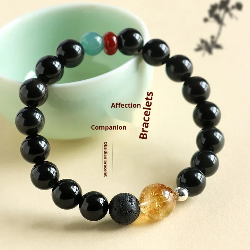 Chinese style obsidian yellow tower crystal and agate jade beaded bracelet shown in 8mm and 10mm bead sizes