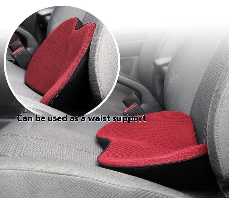 Flat black memory foam car seat cushion on a grey car seat.