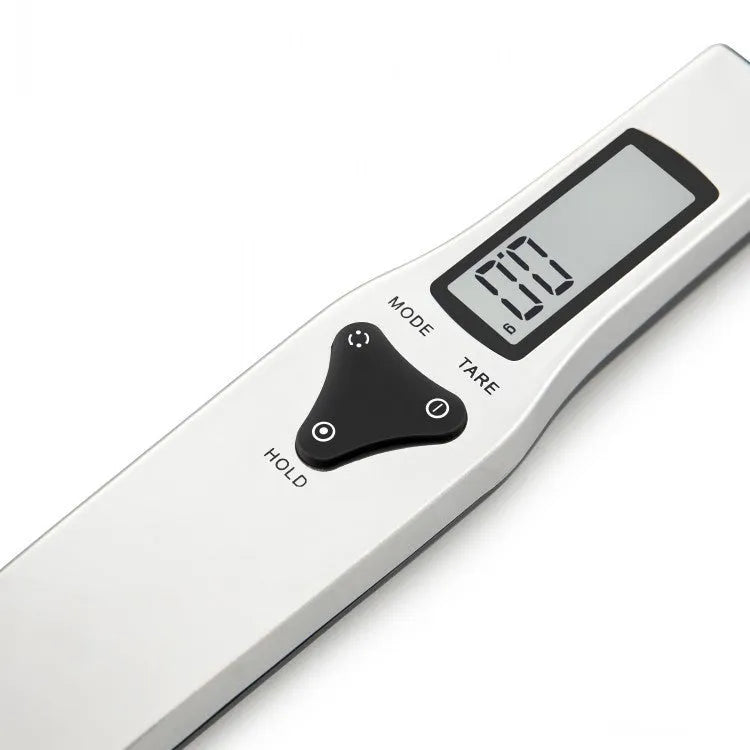 Stainless steel smart digital measuring spoon with a black LCD display showing weight measurement.