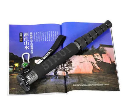Black carbon fibre telescopic monopod for SLR cameras, shown at full extension.