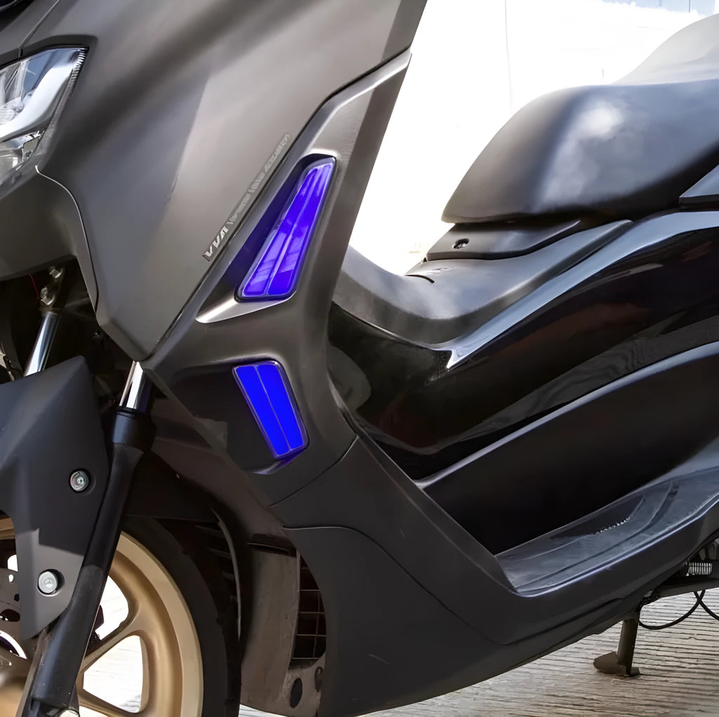Pair of LED turn signal lights for Yamaha NMAX155 scooter in plastic housing.