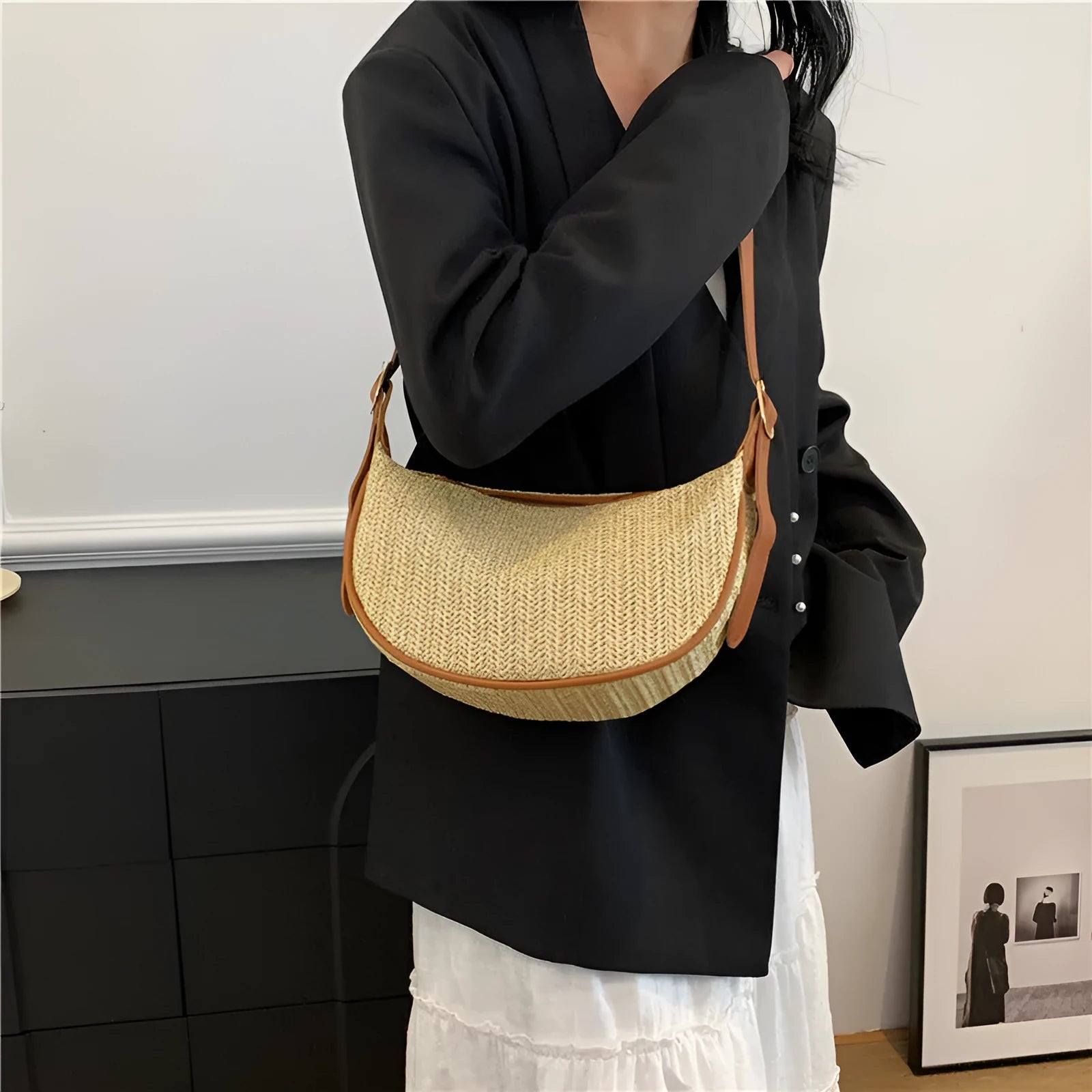 Women's woven straw crossbody bag showing internal phone pocket and document compartment