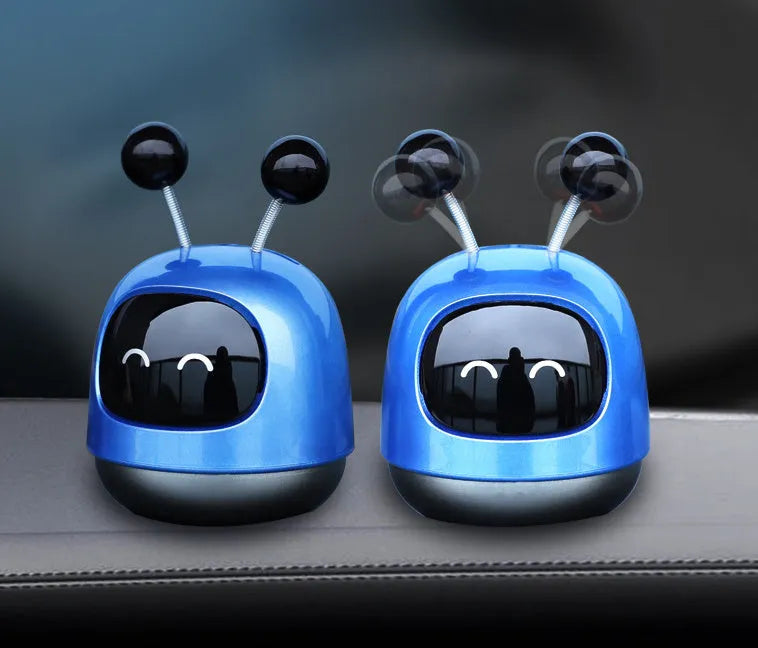 Creative robot car design car vent air freshener aromatherapy decoration in blue, grey, or red.