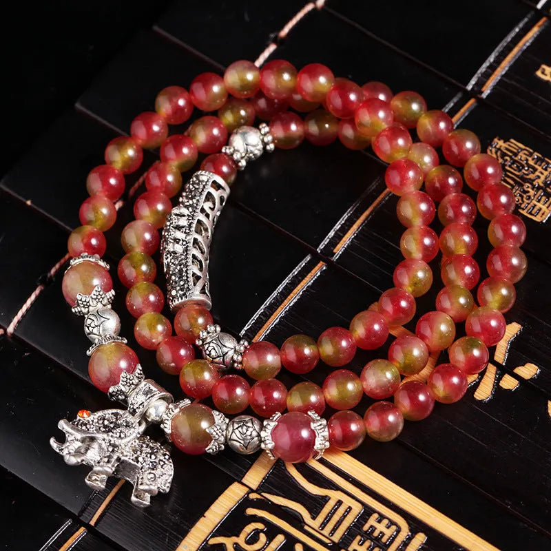 Handmade natural watermelon crystal bracelet with Chinese knot design and geometric beads in elephant style colours
