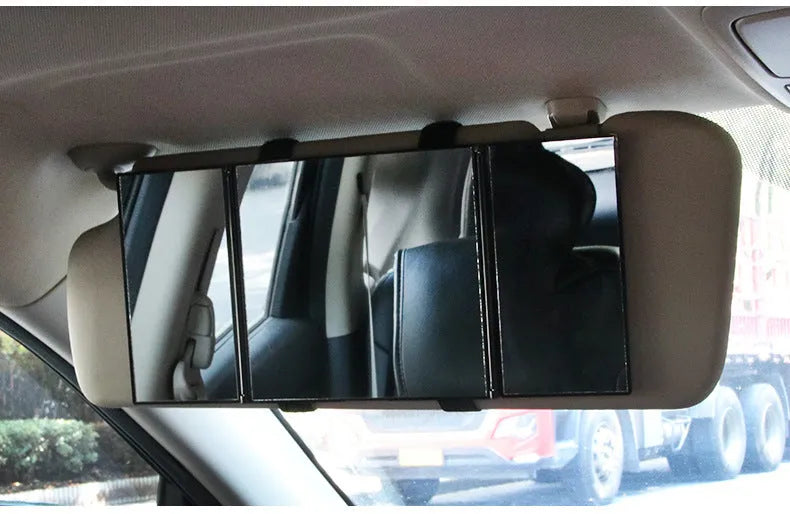 Silver portable folding car mirror shown both closed and open to double its length.
