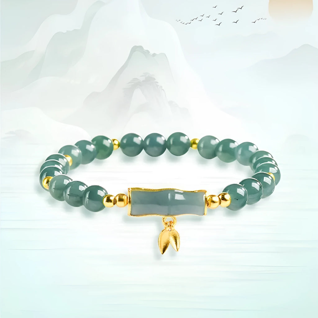 S925 sterling silver bracelet for women with a blue water round bead and cargo jade charm.