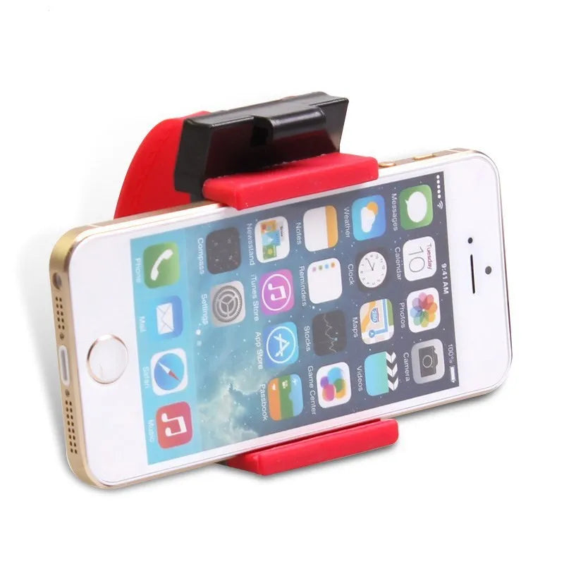 Black universal steering wheel phone holder clip mount attached to a car steering wheel.