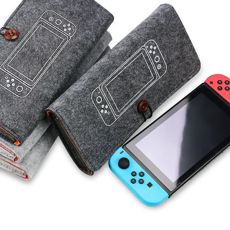 Black felt pouch case for Nintendo Switch open to show console compartment and five game card slots.