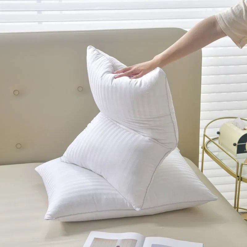 White cotton satin stripe pillow with feather and cotton fill, shown in three different size options.