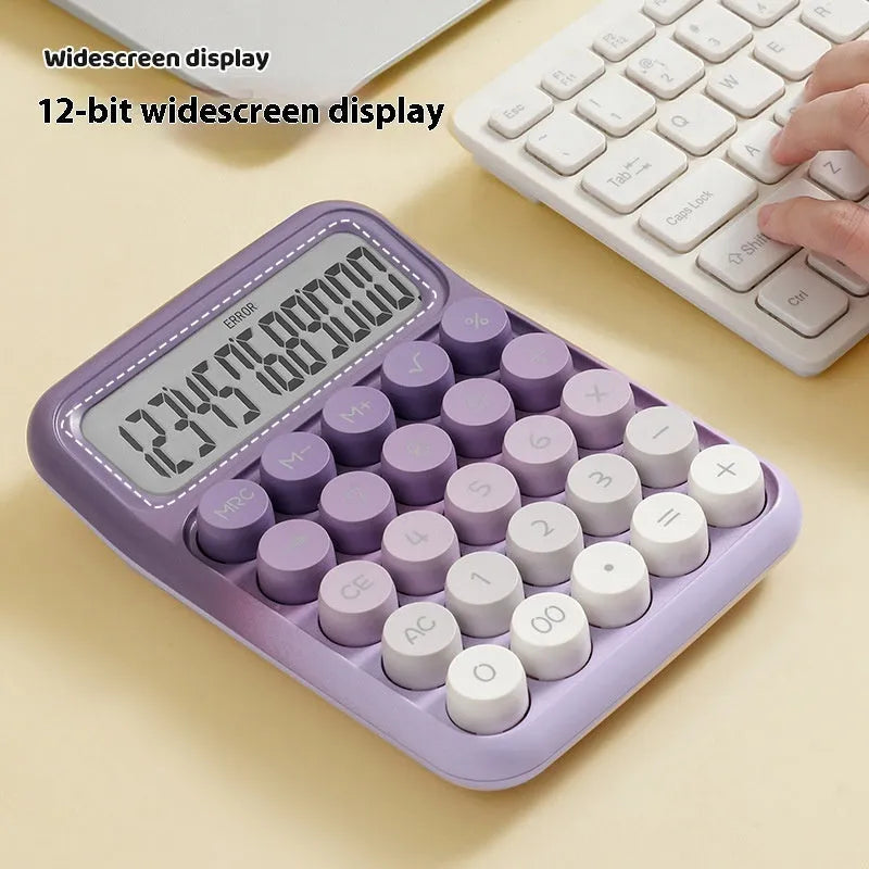 Gradient colour mechanical keyboard calculator on a desk showing LCD display.