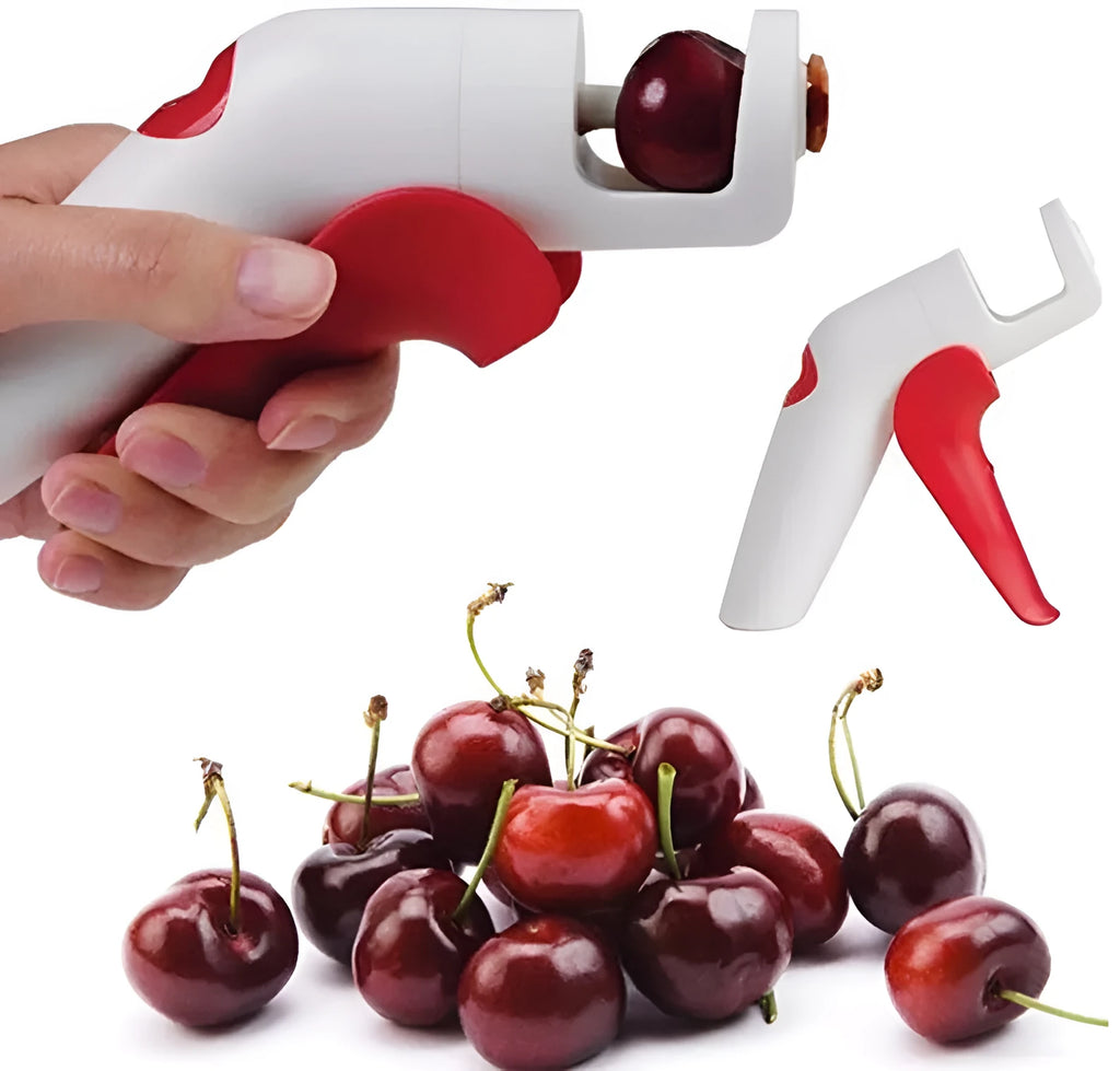 Cherry pitter kitchen tool with soft-grip handle and stainless steel plunger on a plastic base.