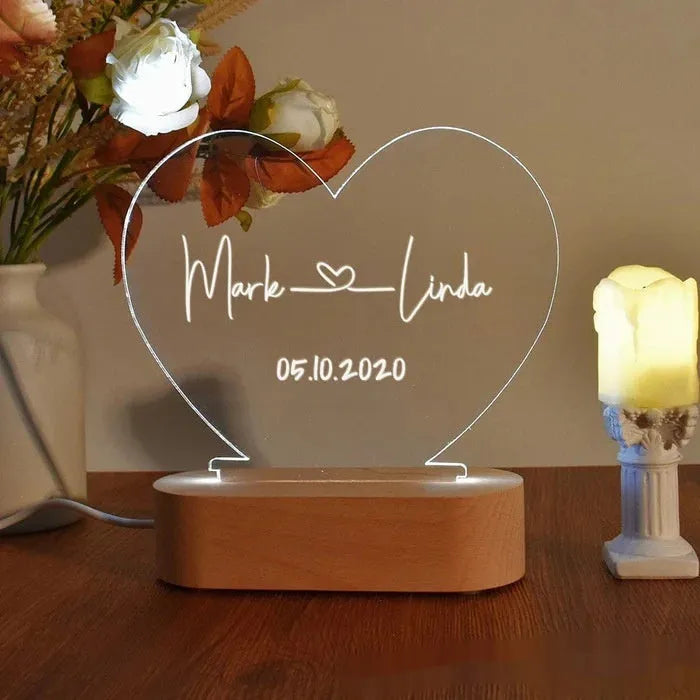 Custom transparent acrylic night light with LED base showing personalised text